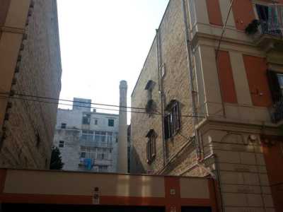 Su via Trento ci imbattiamo nella vecchia fabbrica di cera, su cui svetta ancora la ciminiera che punta verso il cielo quasi del tutto nascosta dai fabbricati